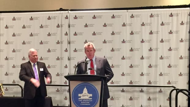 Scott Deal received the first Hammond Marine Industry Leadership Award at the American Boating Congress on Tuesday. NMMA president Thom Dammrich is at left.