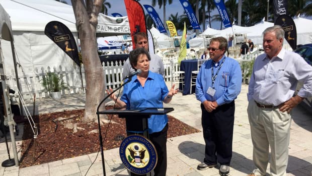 U.S. Rep. Lois Frankel (D- Fla.) promoted legislation Friday at the Palm Beach Interna-tional Boat Show that would allow sellers of foreign-flagged boats to defer payment of the import duty until after the sale takes place. Fort Lauderdale Mayor Jack Seiler, (rear at left); Jeff Erdmann, of the Florida Yacht Brokers Association; and Efrem “Skip” Zim-balist III, CEO of Show Management, also attended.