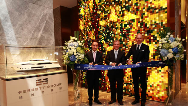 Pierre Barthes (left), Stefano Beltrame and Alessandro Tirelli are shown at the ribbon cutting for the Ferretti Group’s new office in Shanghai.