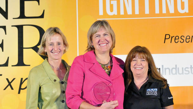 BoatUS president Margaret Podlich (center) received the 2014 Darlene Briggs Woman of the Year Award. She is flanked by former winner Marcia Kull (left), who is vice president of sales at Volvo Penta and Boating Industry magazine national sales director Kathy Johnson.