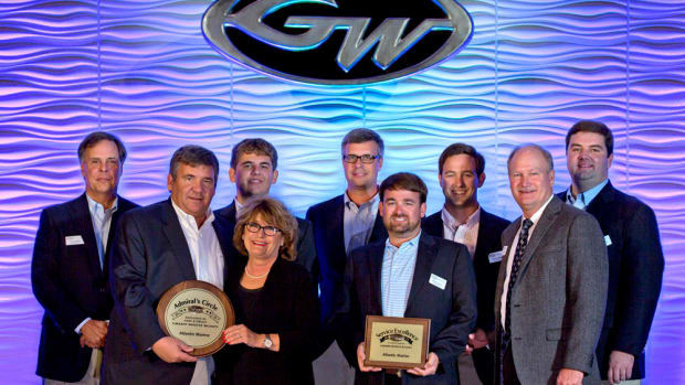 Grady-White Boats president Kris Carroll (front row, left) and sales vice president Joey Weller (front row, right) present awards to dealers.