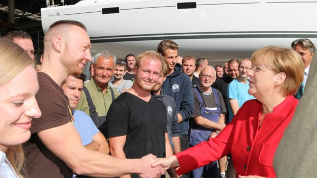 German Chancellor Angela Merkel greets workers at the Hanse Yachts AG shipyard.
