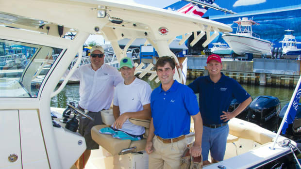 Scout Boats built a 350 LXF luxury center console for Senior U.S. Airman Brian Kolfage (second from left), who survived a rocket attack on an air base in Iraq.