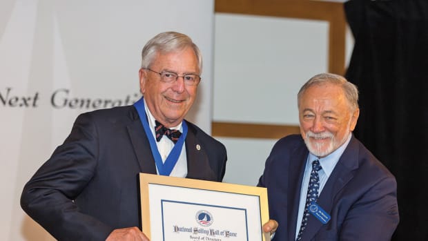 Bob Johnstone (left) gets his certificate from National Sailing Hall of Fame vice president Jim Muldoon.