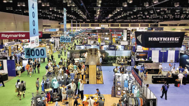Tackle distributors, dealers, retailers and outdoors media representatives mingle on a busy ICAST show floor.