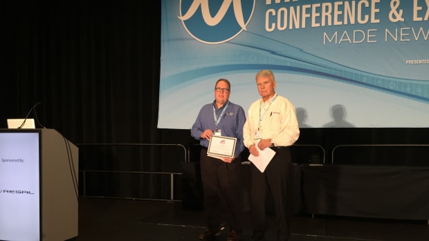 Ed Lofgren (right), president of the MRAA Educational Foundation, presents a scholarship to Wisconsin Indianhead Technical College. Instructor Todd Larson accepted the scholarship on behalf of the college.