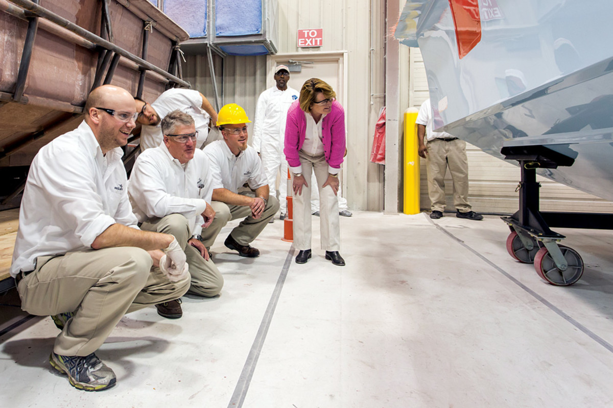 Maxwell and members of the Regulator team check out the progress on the 41-footer.