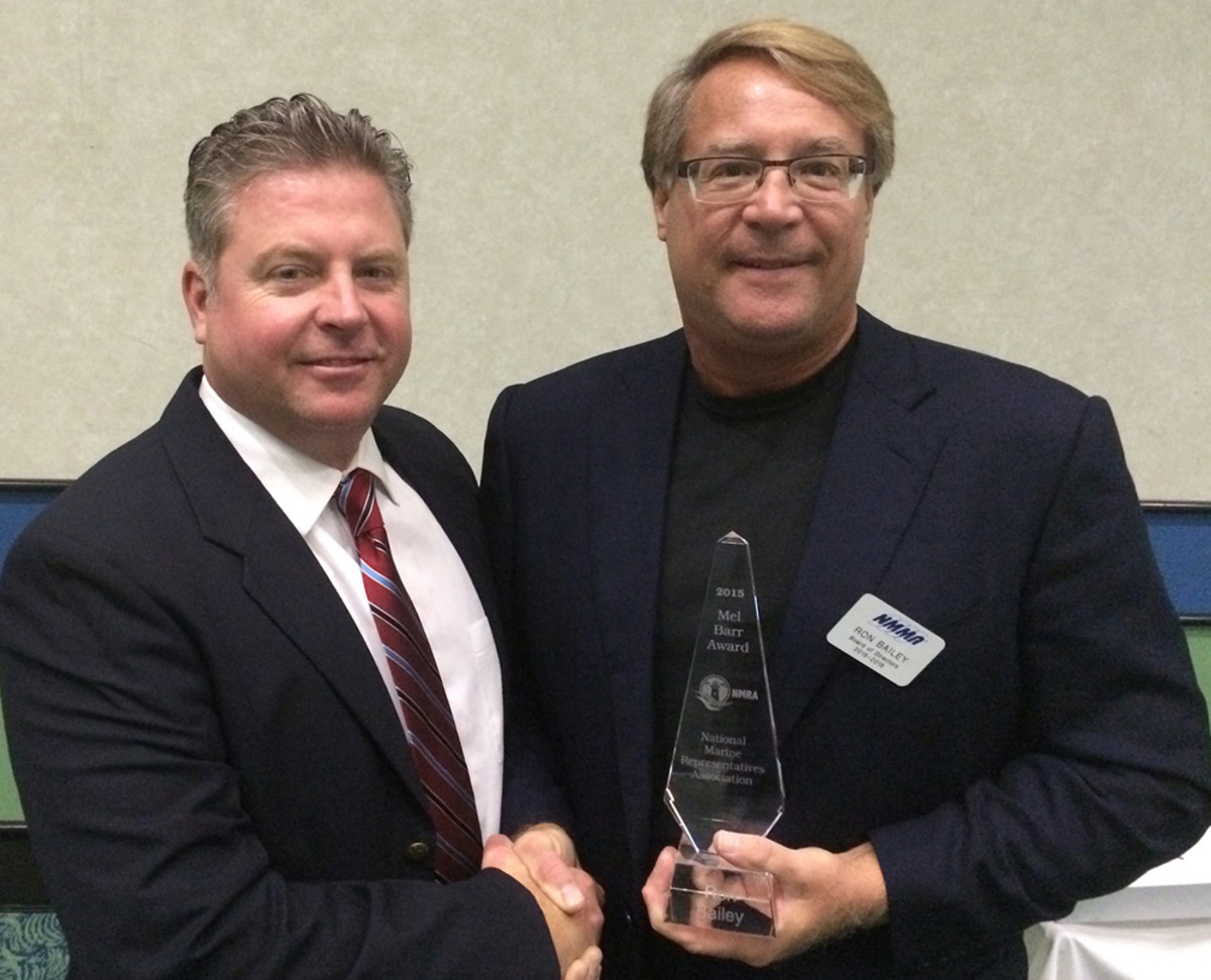 Ron Bailey (right), vice president of sales and marketing at Turning Point Propellers, receives the 2015 Mel Barr Award from Rob Gueterman, incoming president of the National Marine Representatives Association.