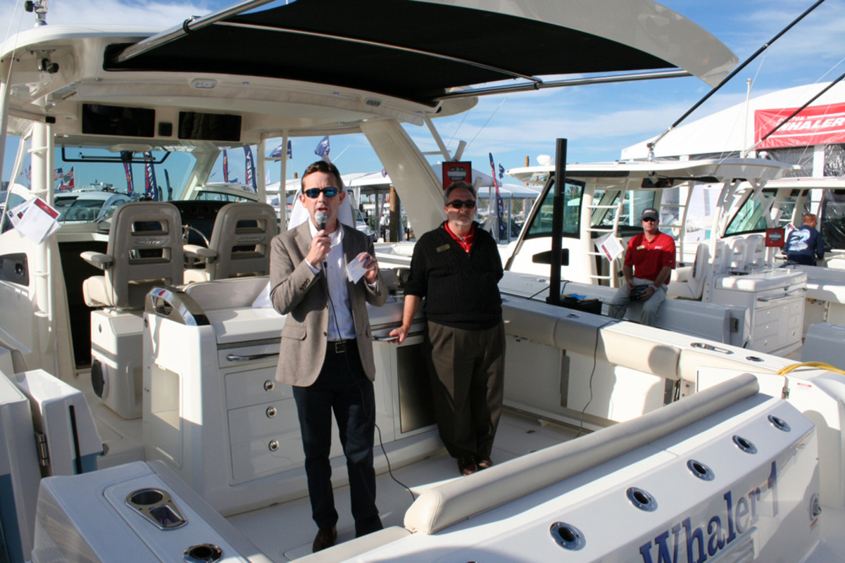 Boston Whaler president Huw Bower (left), and marketing director Jeff Vaughn introduce the manufacturer's new 420 Outrage on Thursday at the Miami International Boat Show.
