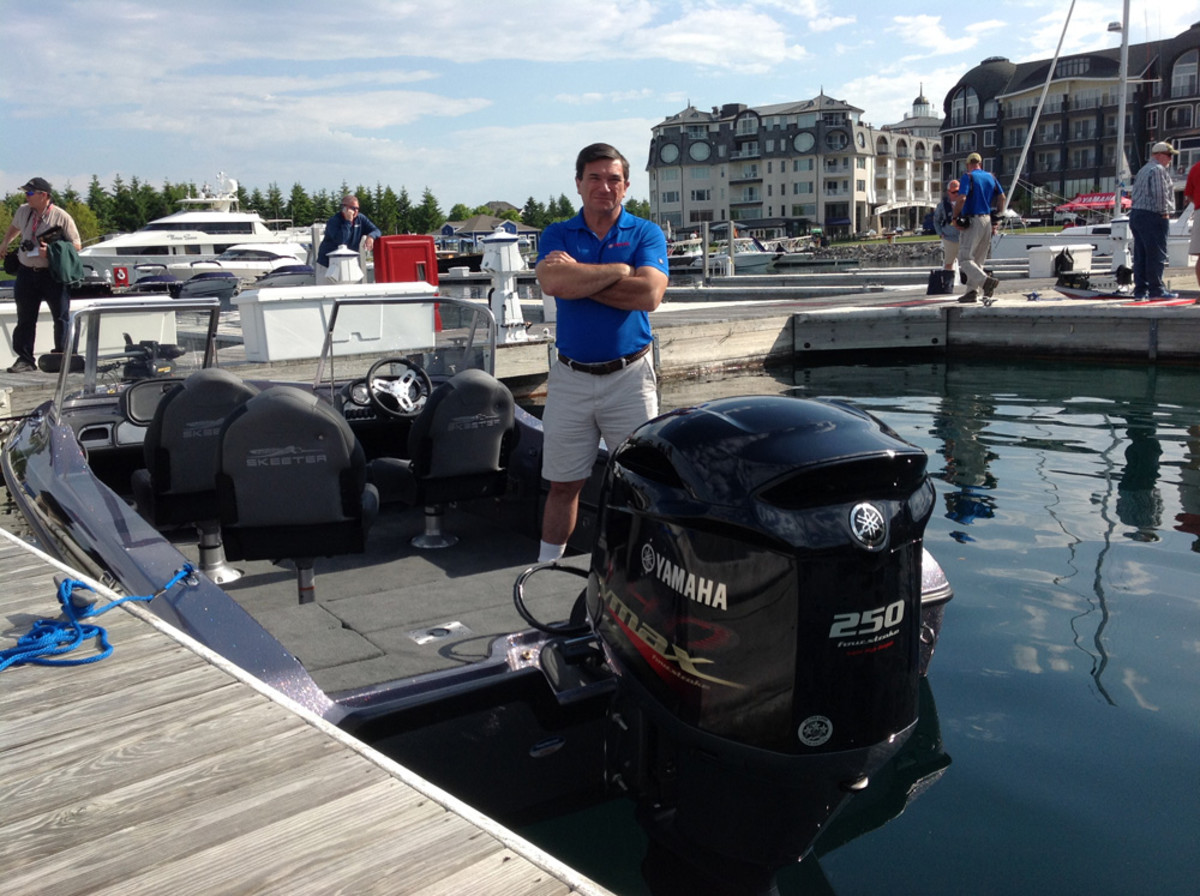 Yamaha manager for government relations Martin Peters is shown next to the new 25-inch shaft model of the 250-hp freshwater V MAX SHO high-performance outboard.