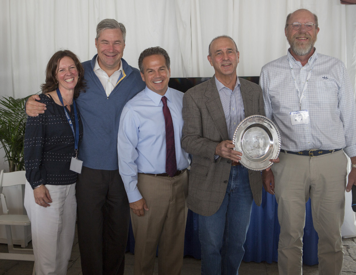 Eric Goetz (second from right) also received the 2014 RIMTA Anchor Award at the organization’s Annual Industry Breakfast. He is shown with RIMTA CEO Wendy Mackie (left), U.S. Sen. Sheldon Whitehouse, U.S. Rep. David Cicilline and Peter Van Lancker. PHOTO CREDIT: Billy Black