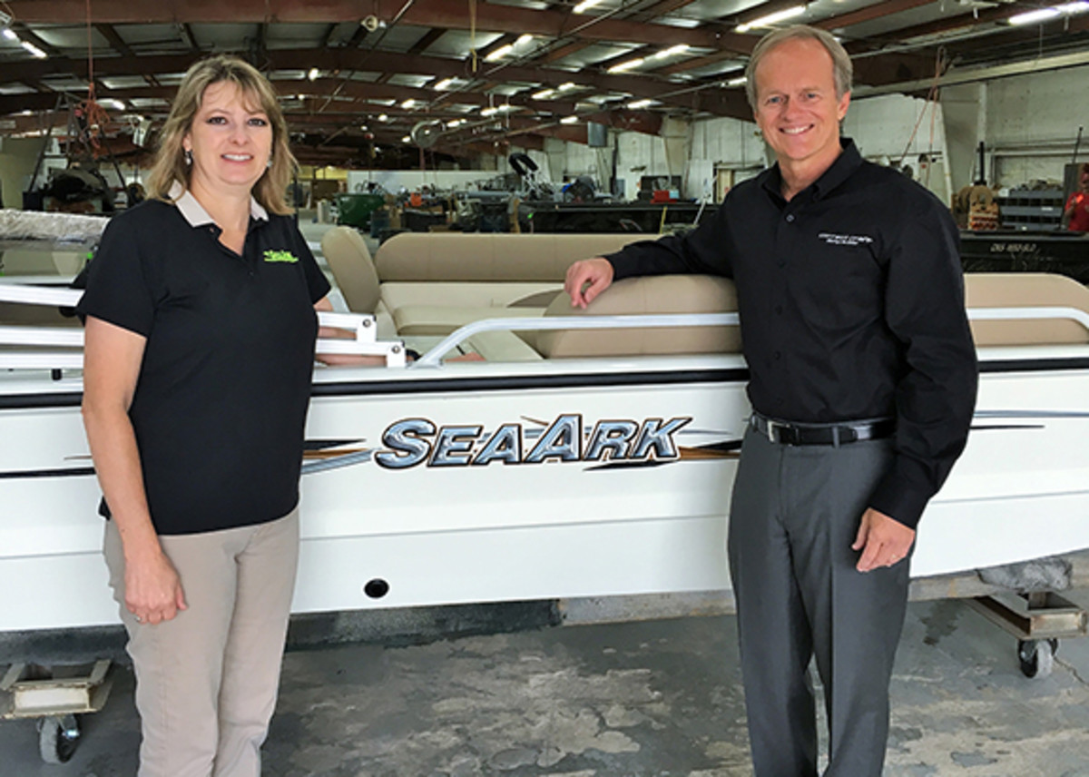 SeaArk Boats founding family member Robin McClendon is shown with Correct Craft president and CEO Bill Yeargin after the acquisition.