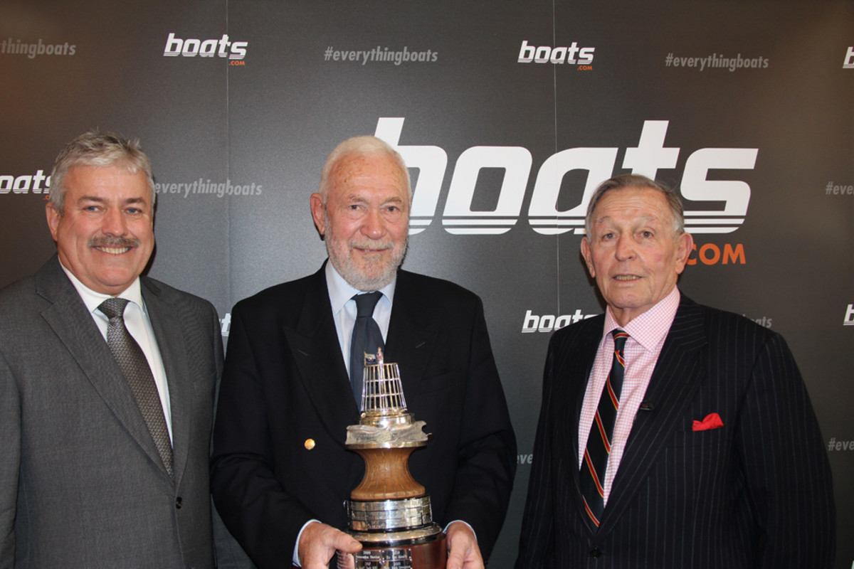 Robin Knox-Johnston (center), the British yachtsman of the year, is shown with Boats.com president Ian Atkins (left) and Yachting Journalists Association chairman Bob Fisher.