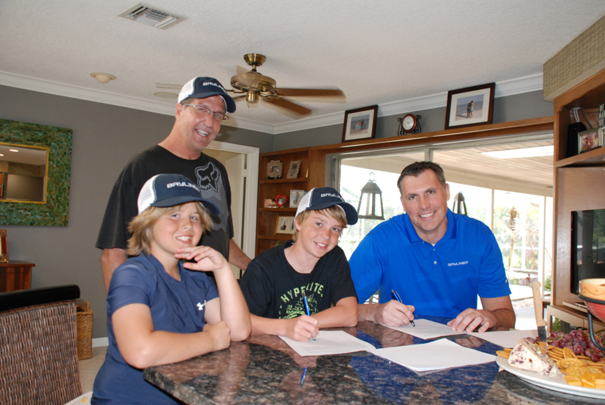 Bayliner Boats is sponsoring nationally ranked champion wakeboard rider Garrett Coleman (center). Coleman, who is 12, will train behind a Bayliner 215 Flight Series Deck Boat.