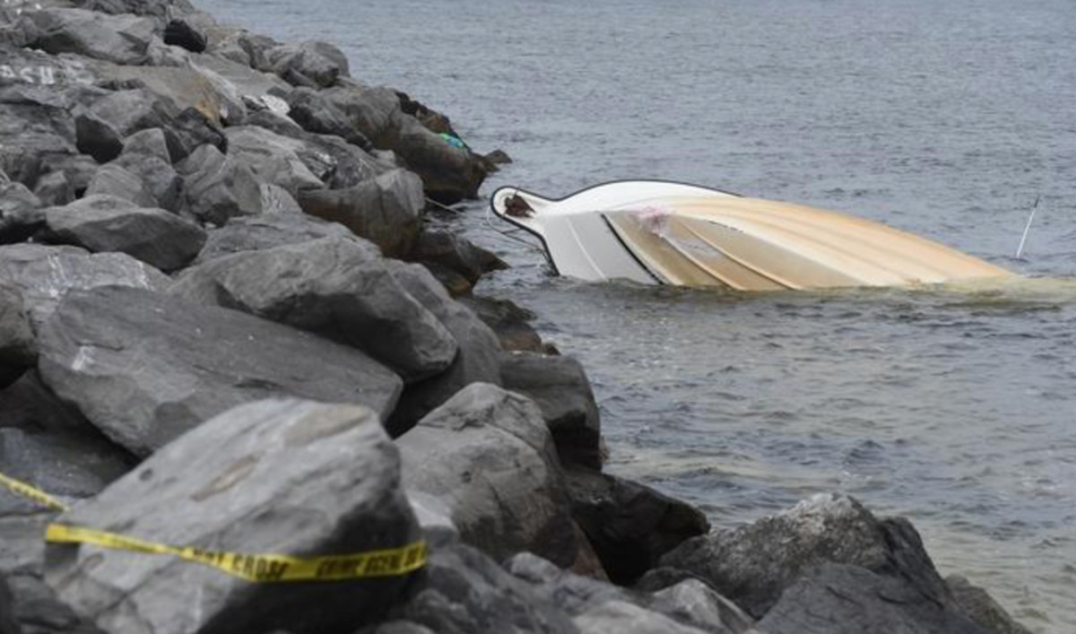 A file photo from the Walton (Fla.) Sun shows the scene of a boat crash in March at the east Destin jetty that killed two people and injured 10 others.