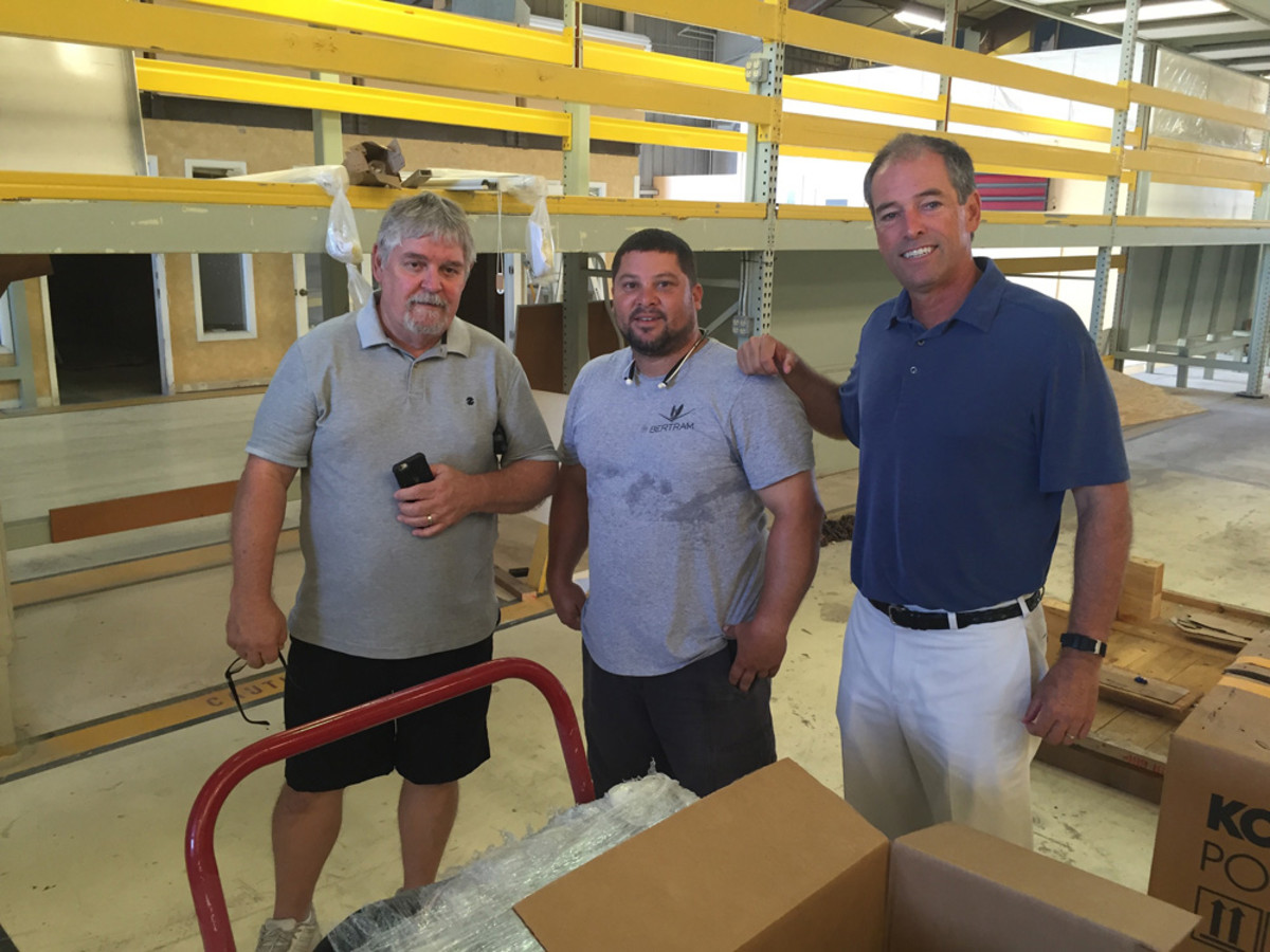 Truslow (right) is shown with materials manager Wayne DeLoach (left) and mechanical leader Alex Cadiz.