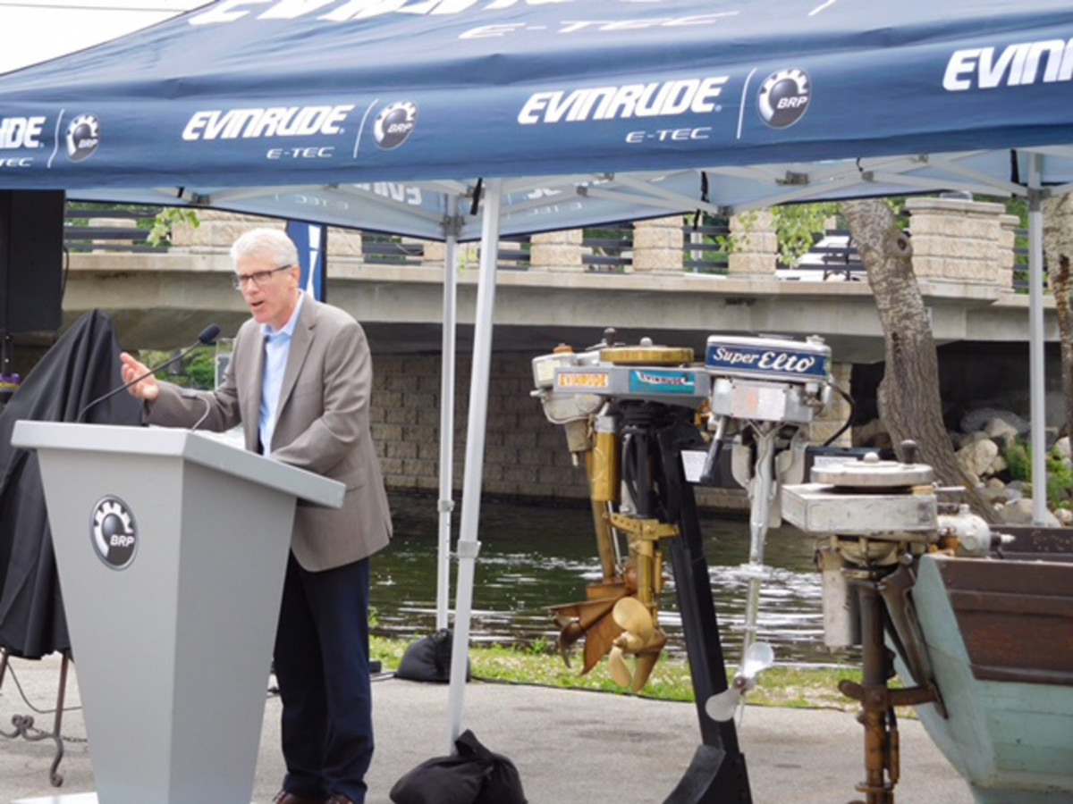 Alain Villemure, vice president and general manager of BRP’s marine propulsion systems division, speaks Thursday at the dedication of a memorial to Ole Evinrude, inventor of the outboard engine.