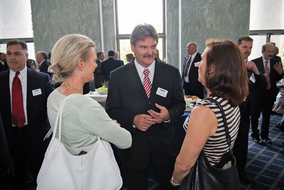 McKnight greets some of the guests at an industry reception on Capitol Hill.