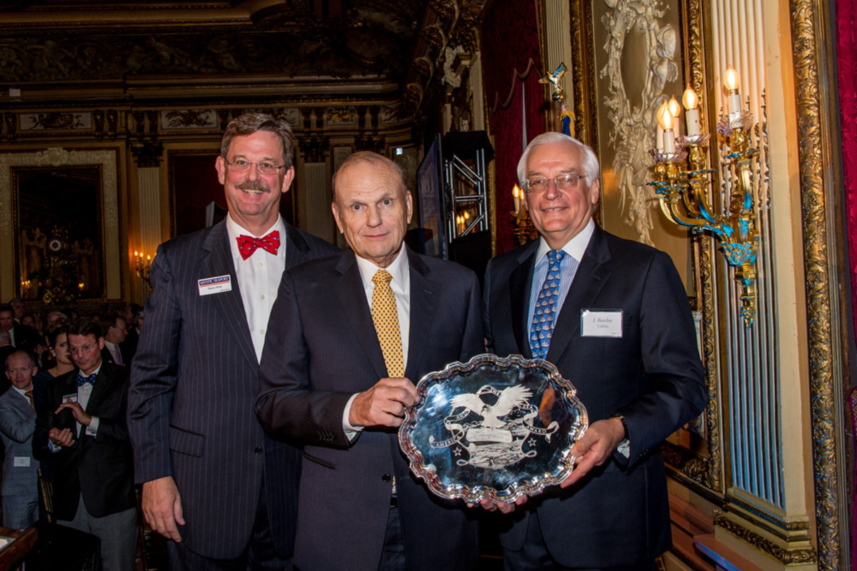 Charles A. Robertson (center) receives the America and the Sea Award in New York City on Nov. 5. Pictured with Robertson are Mystic Seaport president Steve White (left) and Board Chairman J. Barclay Collins (right).
