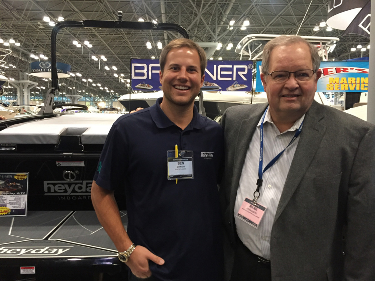 Brunswick CEO Mark Schwabero (right), shown with Heyday founder Ben Dorton at the New York Boat Show, discussed concerns about potential import taxes with investors before heading to the show.