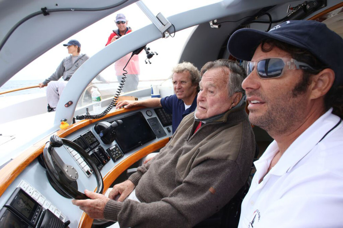 Harry Horgan (left), former President George H.W. Bush and Capt. William Rey are shown aboard the Impossible Dream. PHOTO CREDIT: Evan Sisley, Office of George Bush