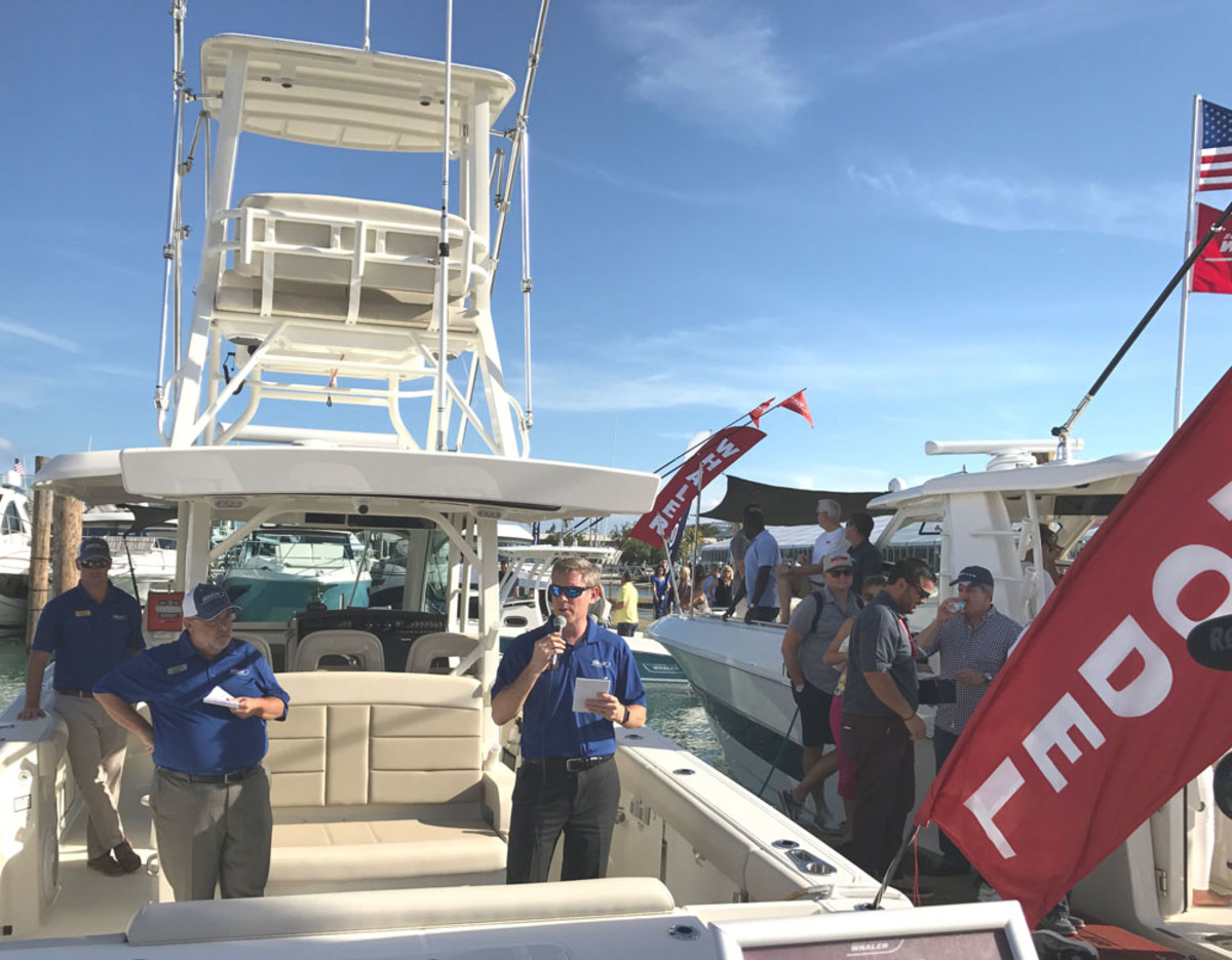 Boston Whaler president Nick Stickler (right) introduces the new 380 Outrage center console Friday at the Miami International Boat Show. Also shown are vice president of sales, marketing and customer service Jeff Vaughn (center) and design manager Charlie Foss.