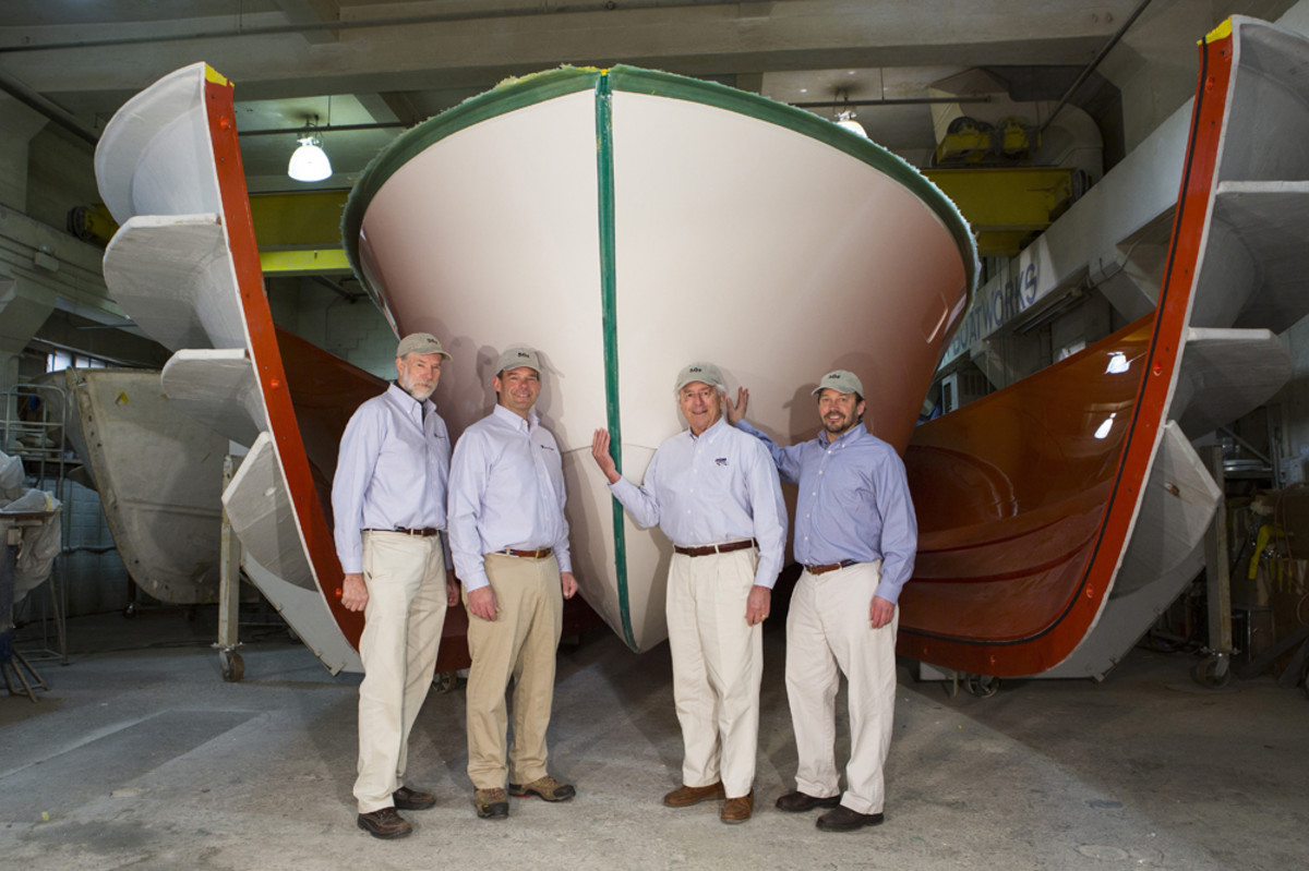 Shown with the first MJM 50z as it comes out of the mold are MJM team members (from left) Mark Lindsay, Scott Smith, Johnstone and designer Doug Zurn.