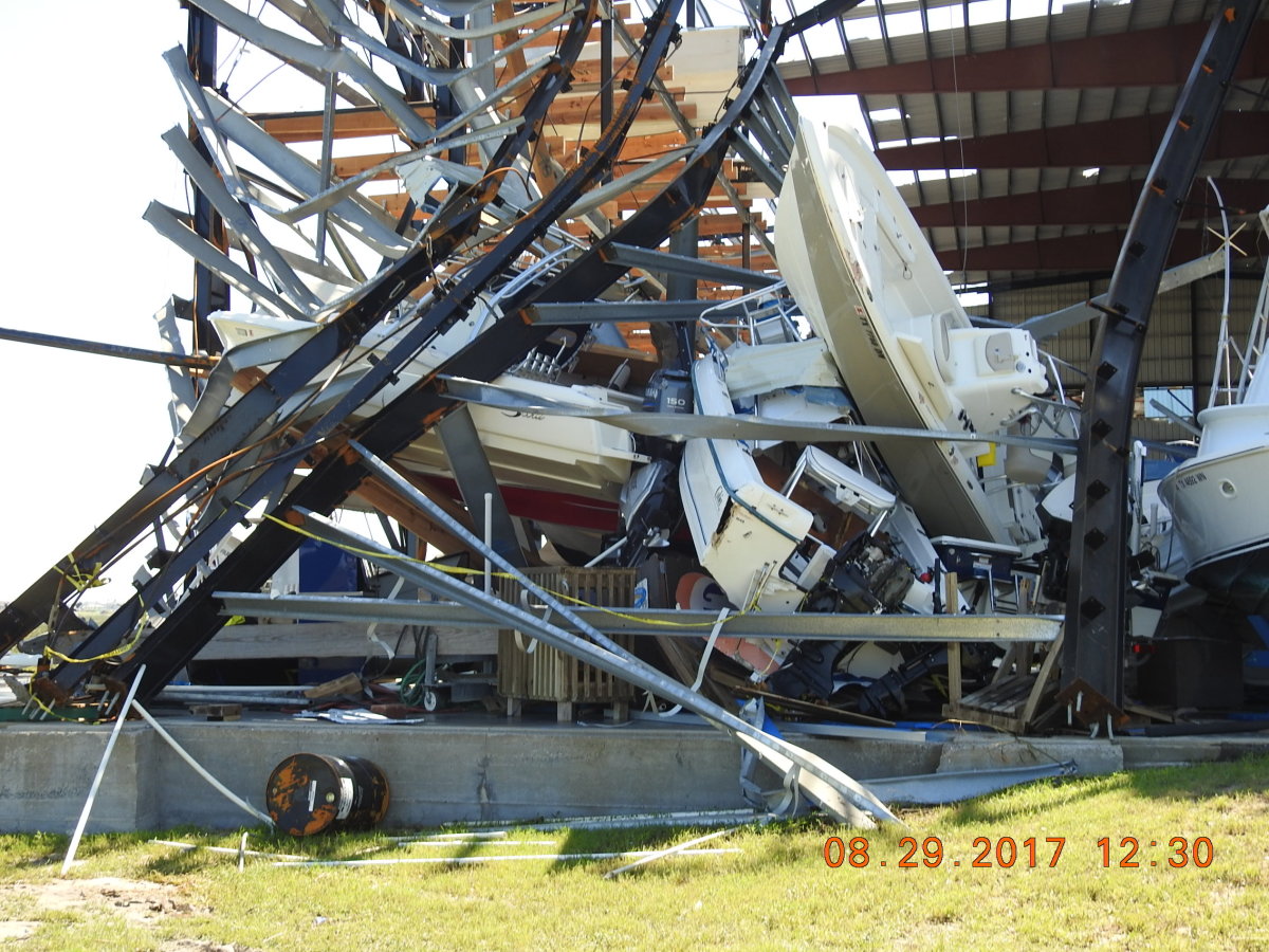jumble of boats and twisted structural metal at Cove Harbor Marina in Rockport, Texas.