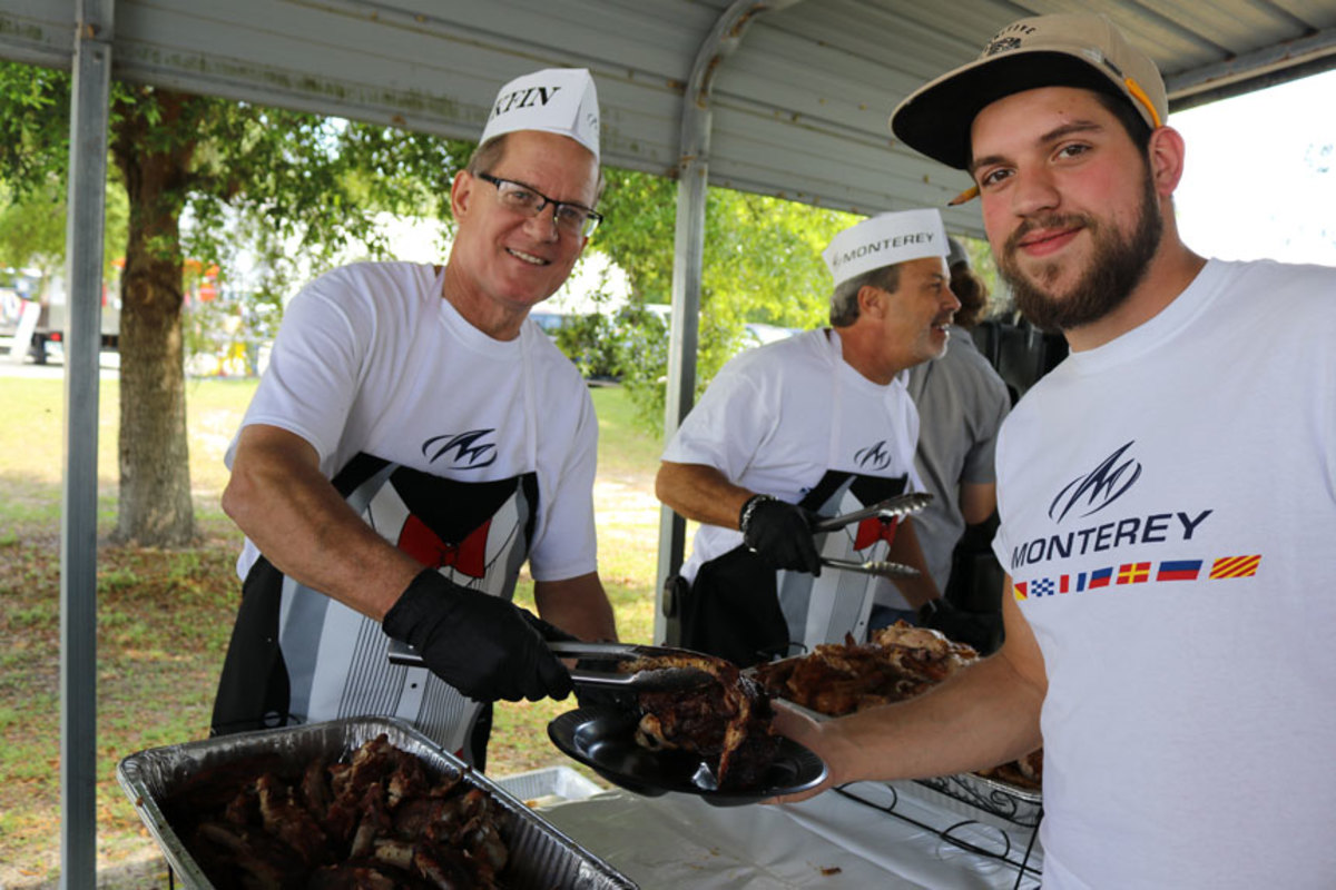 Monterey executives serve employees barbecue chicken.  (L-R) Phil Baier, Vice President Of Manufacturing, Mark Owens, Vice President Of Design & Engineering, Richie Sears, Hull Rigging.