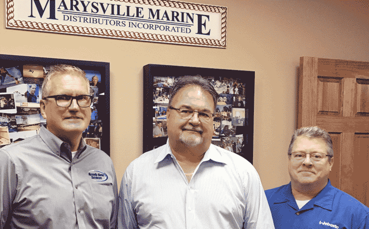 Matt Harvey (L) and John Dillon (R) of Marysville Marine with David Wollard, Webasto senior director of leisure markets.