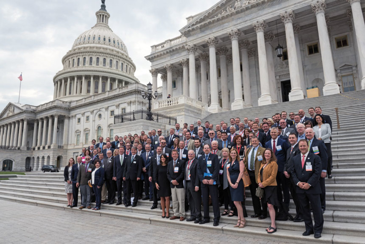 The attendees gathered on the steps of the Capitol building before convening on day two.