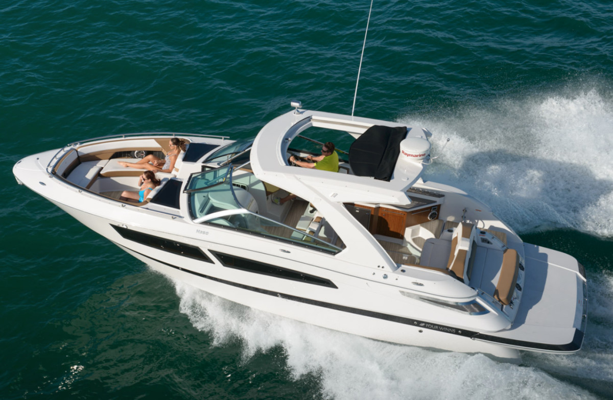 Groupe Beneteau, which builds four brands of boats in Michigan including this Four Winns model, says tariff threats have caused order cancellations worries that will mean layoffs.