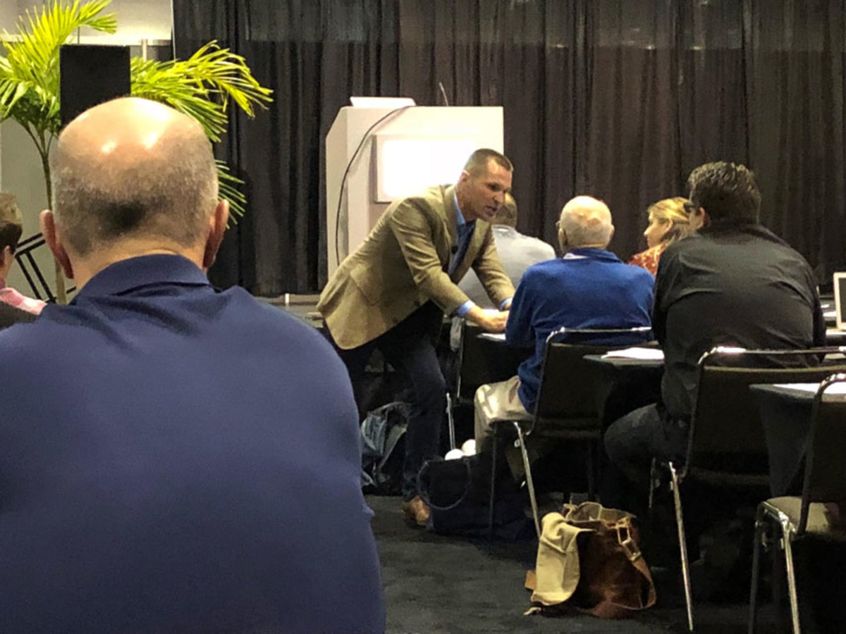 Marcus Sheridan (leaning in to talk to an audience member) told an MDCE audience that because 70 percent of a boat-buying decision is made before a customer meets a dealer, it’s crucial for the industry to provide information customers want to find on iPads and smartphones.