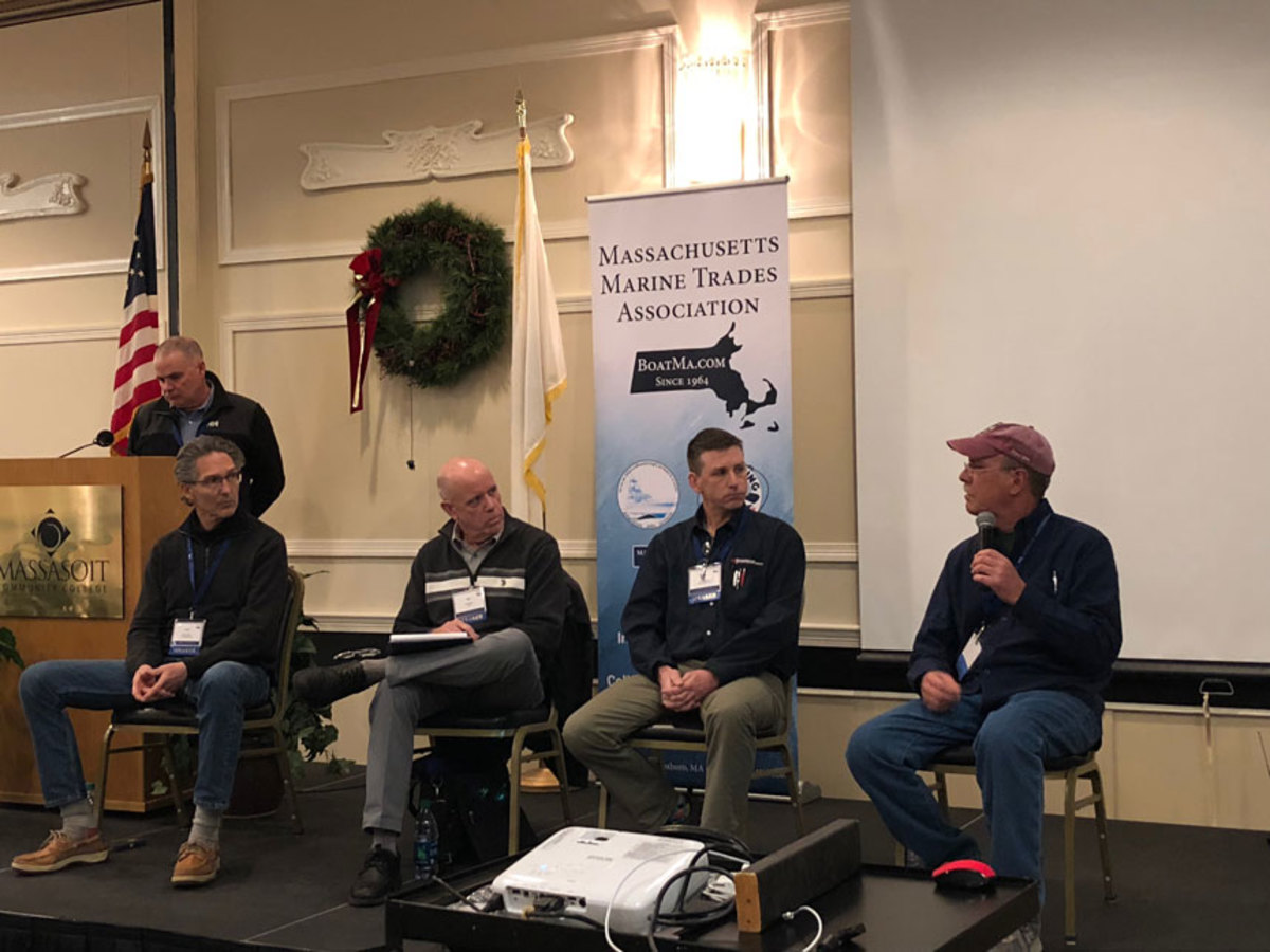 Mike Cheney (right, holding microphone) of Manchester Marine, was one of four members of the panel on workforce and training. From left are Jamie Houtz of The Landing School; Rick Shaw of MTTI; and Pat Desmond of 3A Marine.