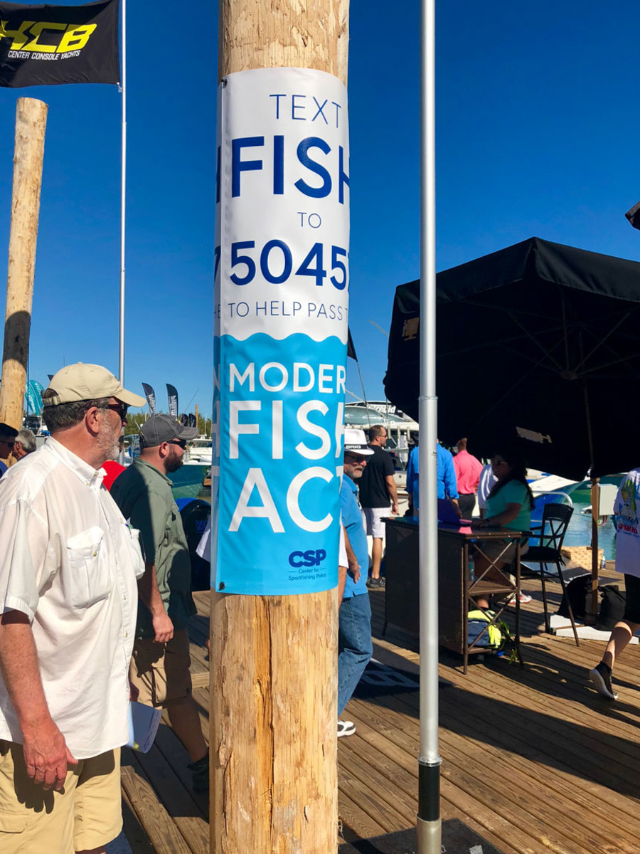 Signs were hung on pilings near the many offshore fishing boats at the Miami show, which is owned and operated by the NMMA, asking visitors to text the word “fish” to 50457 to send letters to members of Congress in support of the bill.