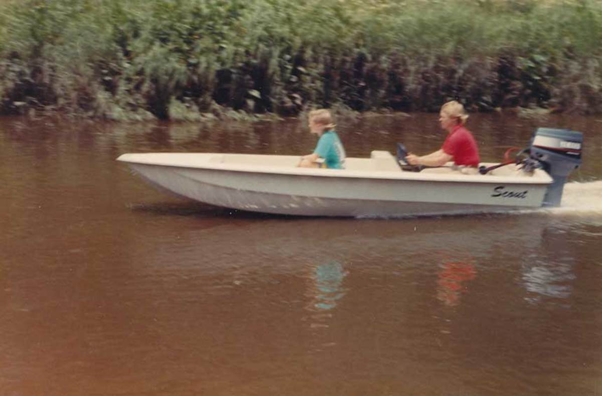 Steve Potts and his son, Steve, on one of the first Scout models in the 1980s.