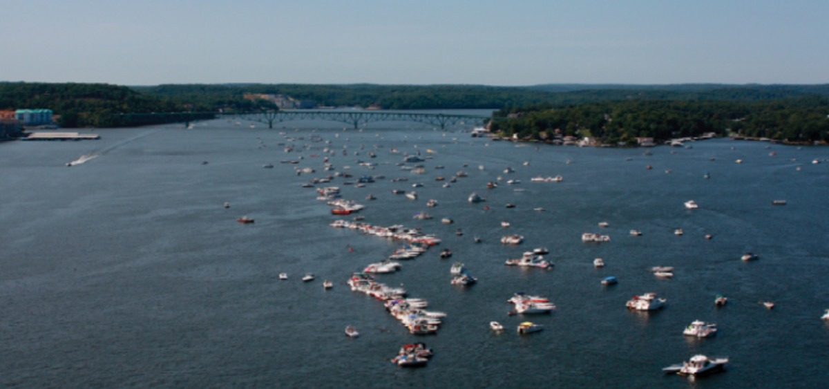 Recreational boats rafted up on the Lake of the Ozarks. One of the busiest boating areas in the Midwest, the Lake of the Ozarks has been a target in the Coast Guard's ongoing crackdown on illegal charter operations. Corps of Engineers photo.