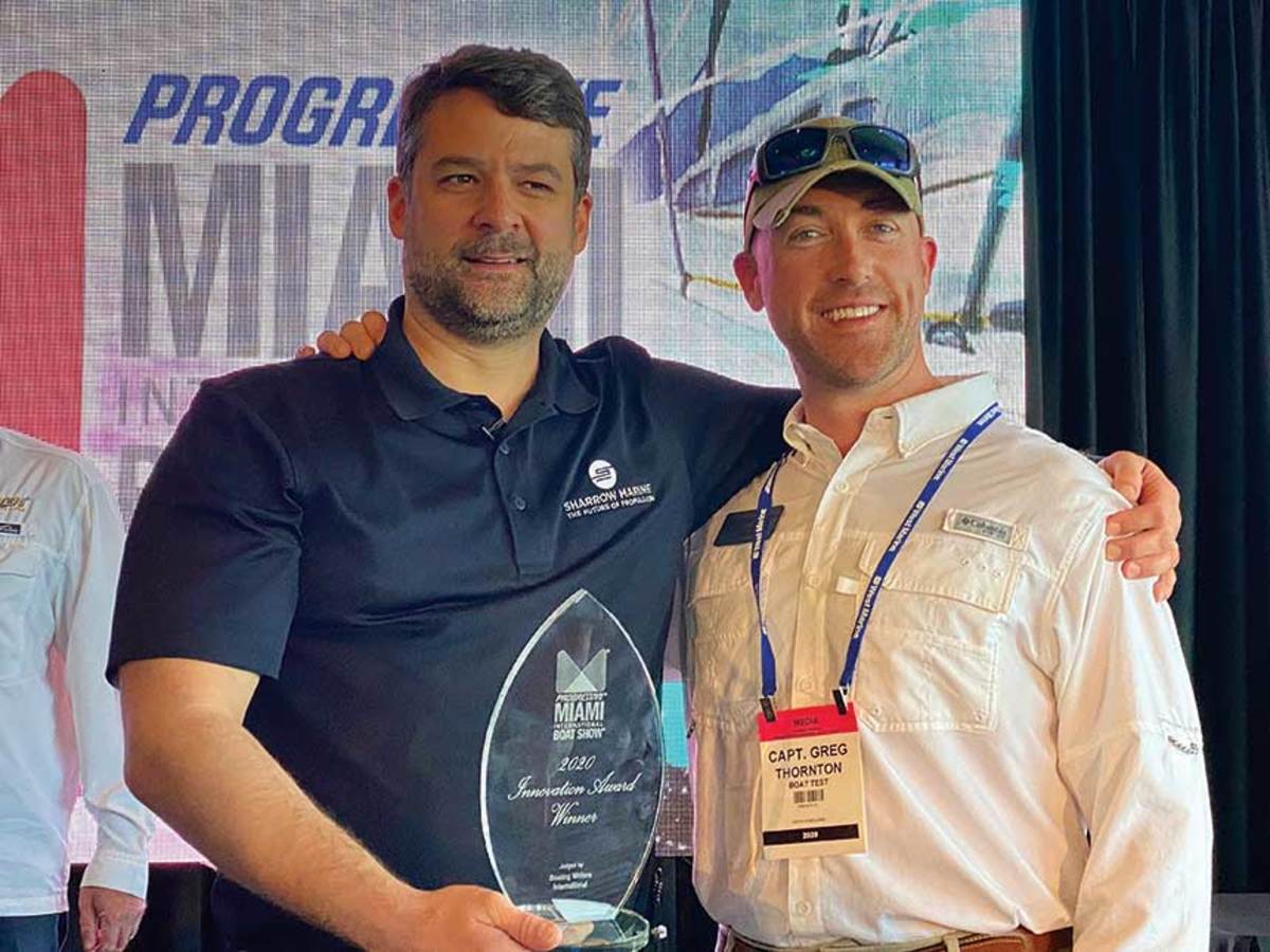 Greg Sharrow (left) won an NMMA Innovation Award for the MX-1 propeller at the Miami International Boat Show earlier this year.