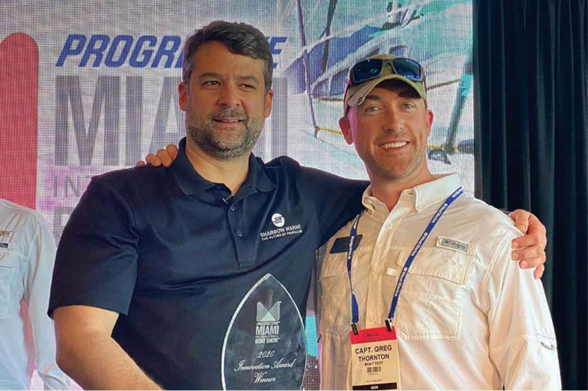 Greg Sharrow (left) won an NMMA Innovation Award for the MX-1 propeller at the Miami International Boat Show earlier this year.