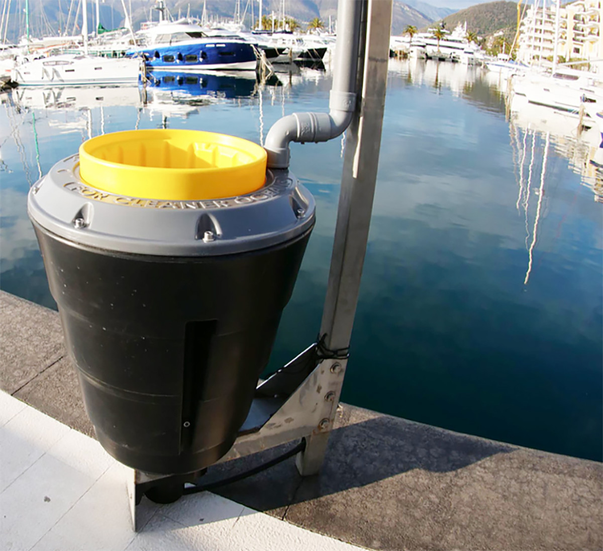 The Seabin resting on a pier; the unit captures waterborne refuse while floating through the water.
