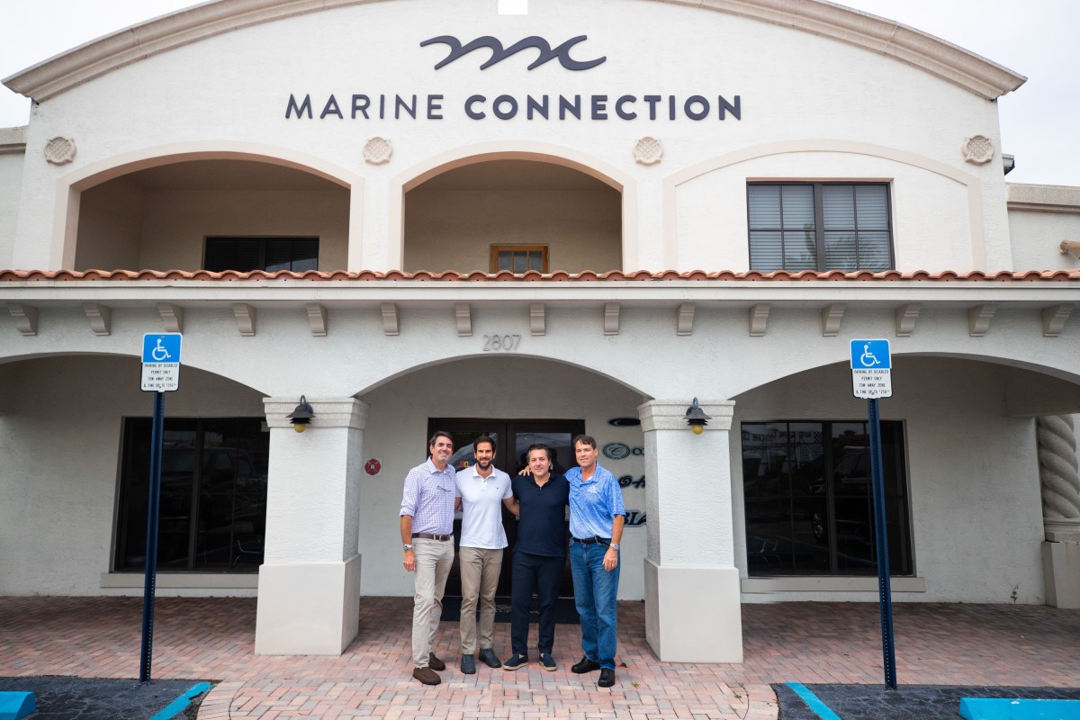 Marine Connection’s Danny Goldenberg and John Kutuk, center, are flanked by Boaters Exchange minority owners Jerry Butz, left and Paul Berube, right.