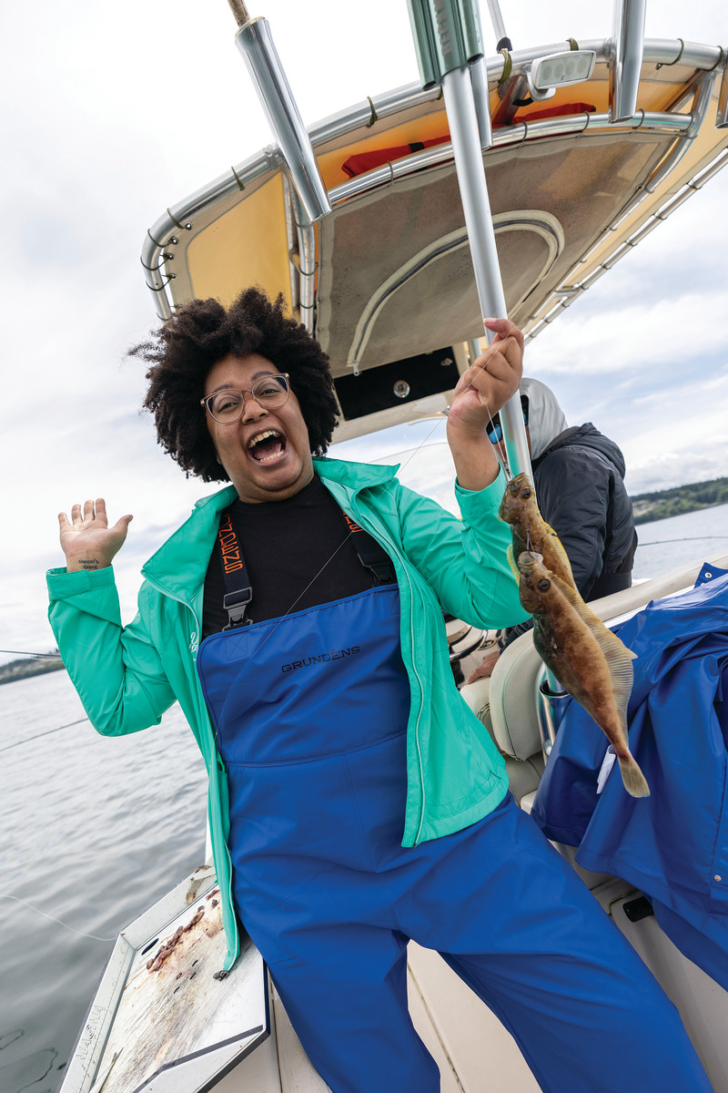 Journalist and author Nneka M. Okona celebrates a nice catch during a Women Making Waves event in Seattle.