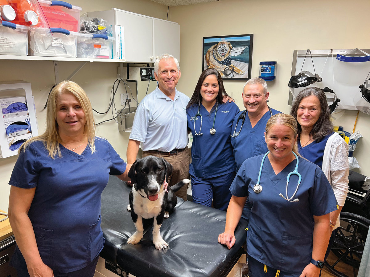 (L-R) Jackie Wurdemann, medical assistant; Milo, therapy dog (in training); Drew Davala, Viking executive vice president and co-founder of Viking Health Services; Billeny Rivera, registered nurse; Steven Marks, Health Services manager and advanced practice nurse, Tammy Heinrich, registered nurse; and Joan Butler, certified medical assistant. 